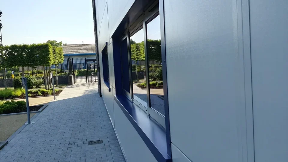 Clean windows along a modern office building